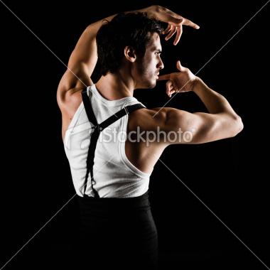 stock-photo-14623590-dramatic-portrait-of-a-latin-male-flamenco-dancer-in-motion[1]